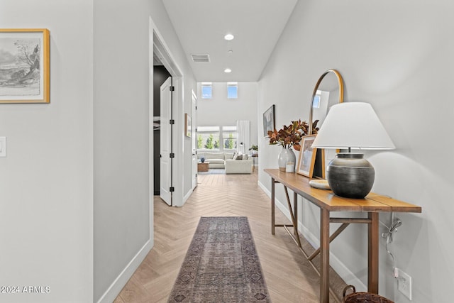 hall featuring light parquet flooring