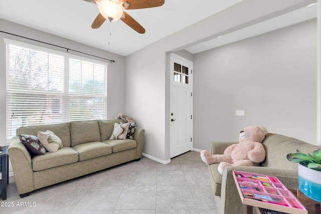 living room with ceiling fan and light tile patterned flooring