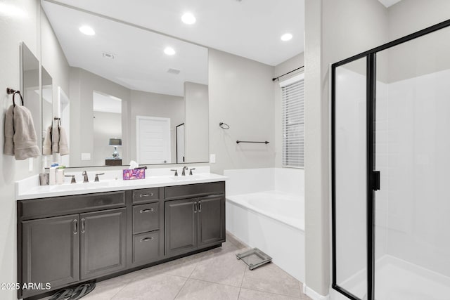 bathroom with vanity, plus walk in shower, and tile patterned flooring