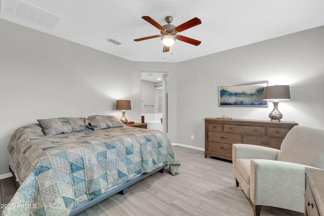 bedroom featuring ensuite bathroom, ceiling fan, and light hardwood / wood-style flooring