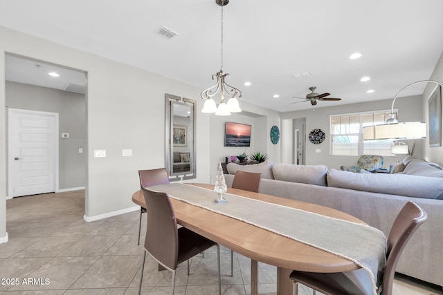 dining space with light tile patterned flooring and ceiling fan