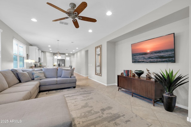 tiled living room with ceiling fan