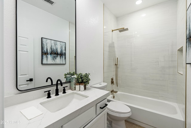 8965 E Maple Dr, Scottsdale, AZ 85255 - bathroom featuring toilet, vanity, bathing tub / shower combination, and recessed lighting
