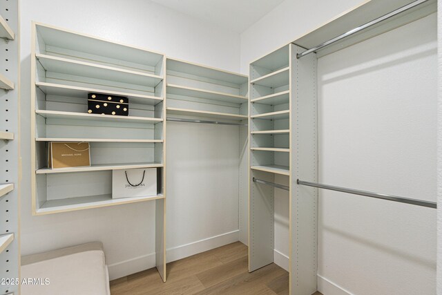 8965 E Maple Dr, Scottsdale, AZ 85255 - walk in closet with wood finished floors
