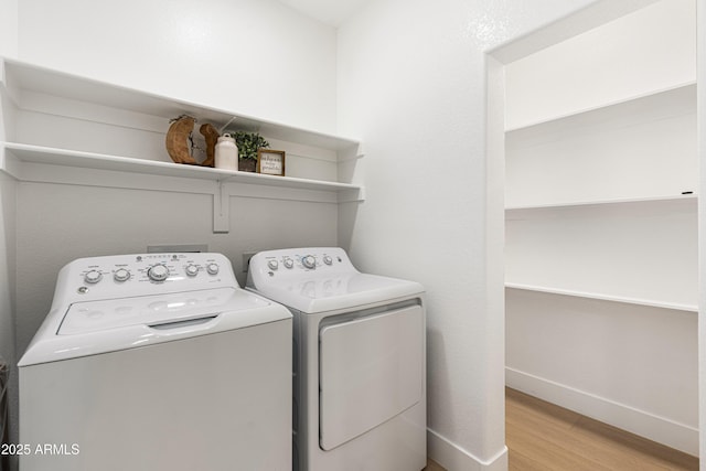 8965 E Maple Dr, Scottsdale, AZ 85255 - washroom featuring independent washer and dryer, light wood-style flooring, and baseboards