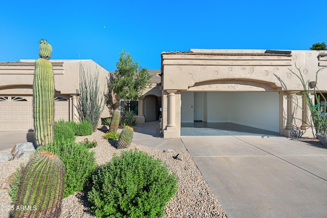 8965 E Maple Dr, Scottsdale, AZ 85255 - southwest-style home featuring driveway, stucco siding, and a garage
