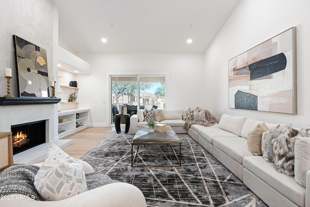 8965 E Maple Dr, Scottsdale, AZ 85255 - living area featuring wood finished floors, a fireplace, recessed lighting, and vaulted ceiling