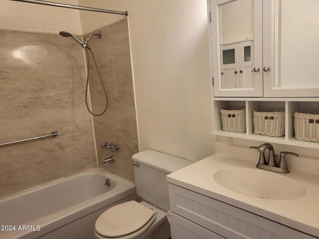 full bathroom with tiled shower / bath, vanity, and toilet