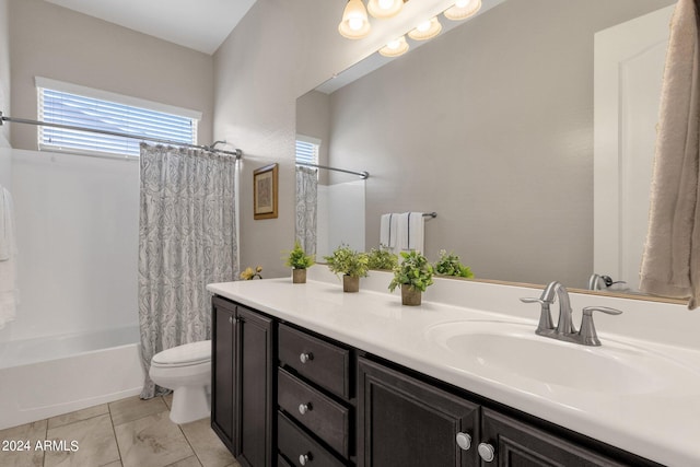 full bathroom with shower / tub combo with curtain, vanity, tile patterned floors, and toilet