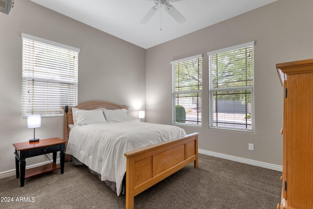 bedroom with dark carpet and ceiling fan