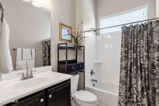 full bathroom featuring toilet, vanity, shower / bathtub combination with curtain, and a wealth of natural light