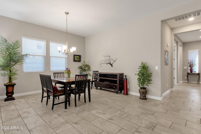 dining space with an inviting chandelier and plenty of natural light