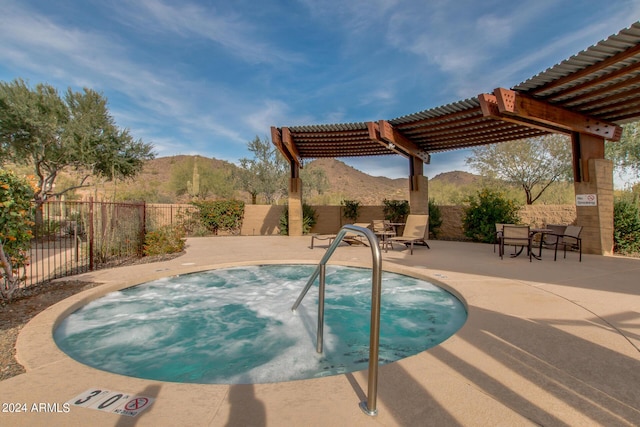 view of pool with a pergola, a mountain view, and a patio area