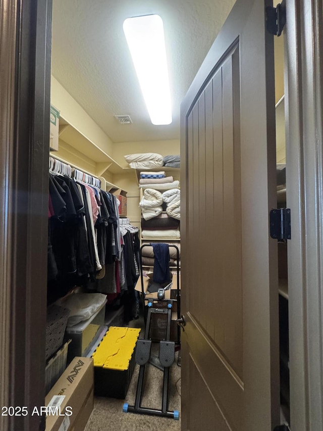 walk in closet with carpet and visible vents