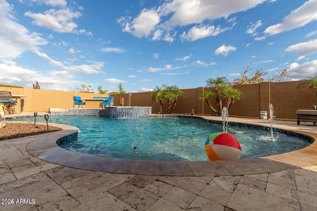 view of swimming pool with a fenced in pool, a fenced backyard, and a patio area