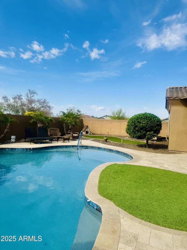 view of swimming pool with a fenced in pool and a fenced backyard