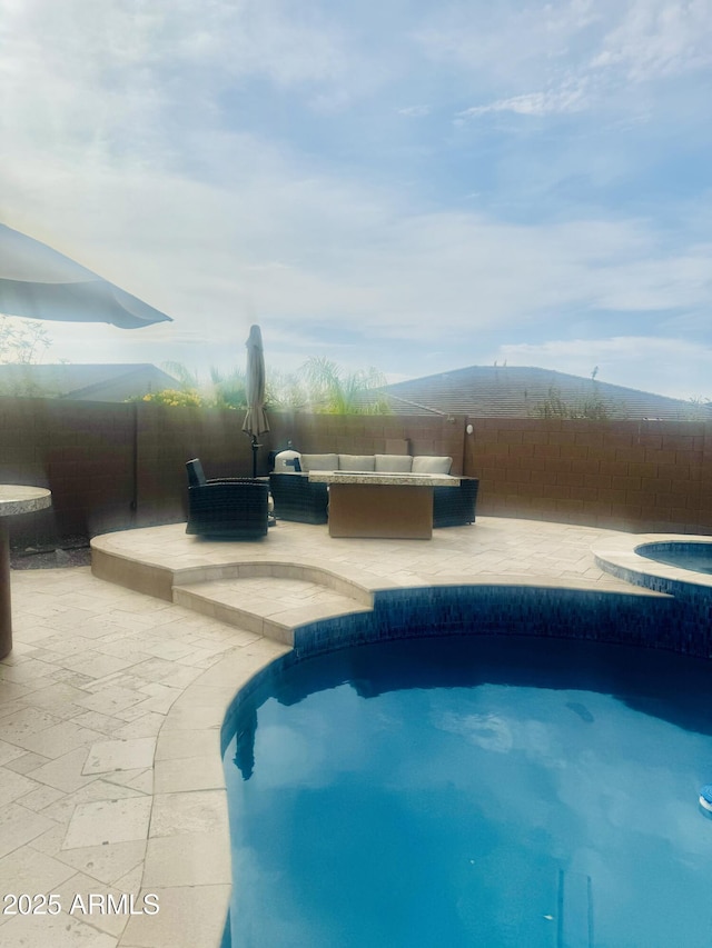 view of pool with a patio, a fenced backyard, an in ground hot tub, and a fenced in pool