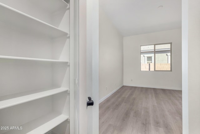 spare room featuring light wood-type flooring