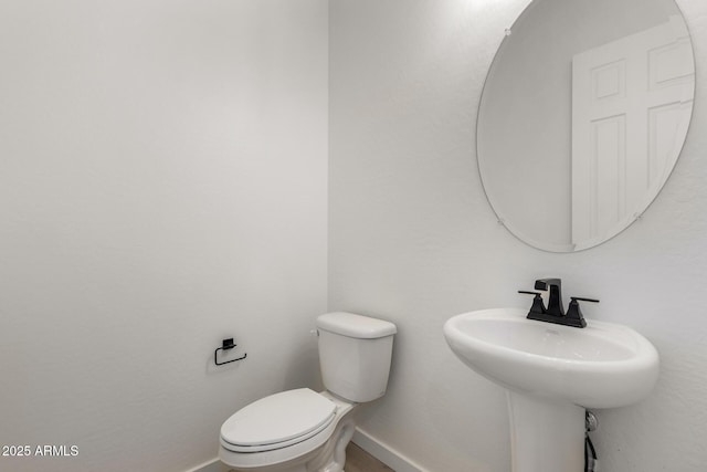 bathroom with toilet and sink