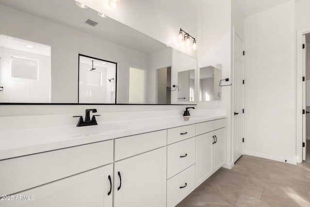 bathroom with a shower and vanity