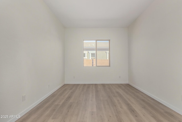 spare room featuring light wood-type flooring