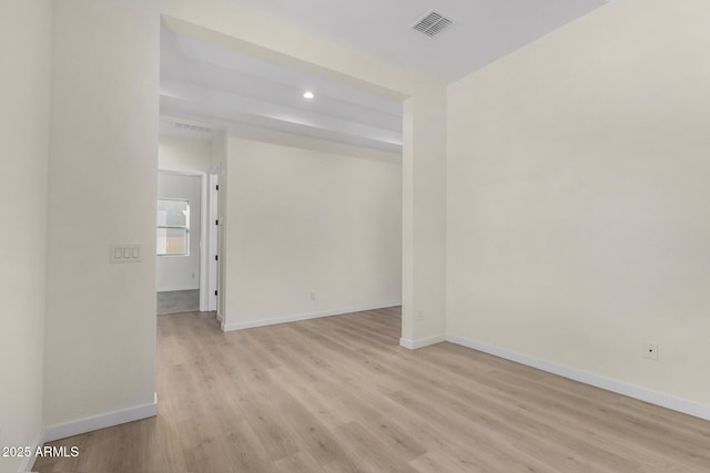 unfurnished room with light hardwood / wood-style floors