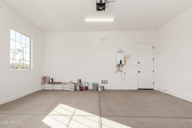 garage featuring tankless water heater