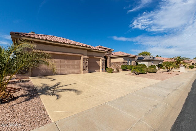 mediterranean / spanish-style home featuring a garage