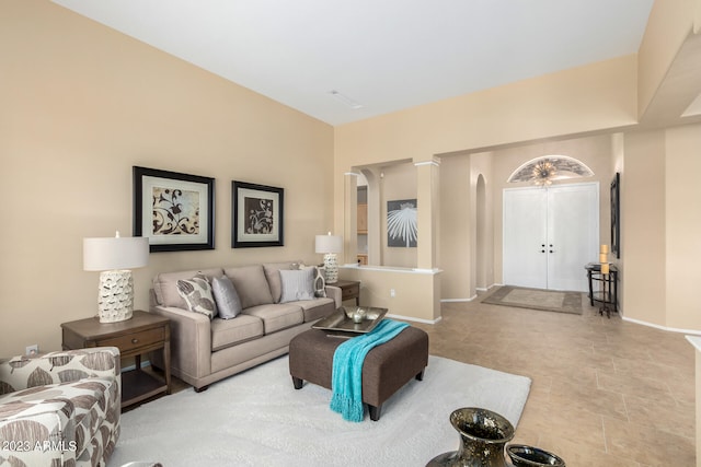 living room featuring ornate columns