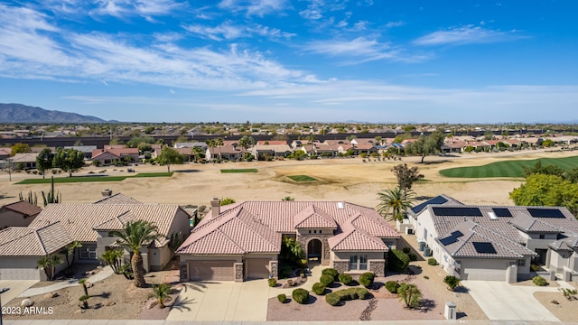 birds eye view of property with a mountain view