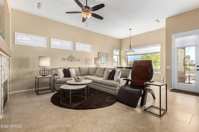 living room featuring ceiling fan and light tile patterned flooring