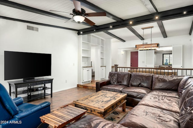 living room featuring beam ceiling, ceiling fan, and dark hardwood / wood-style floors