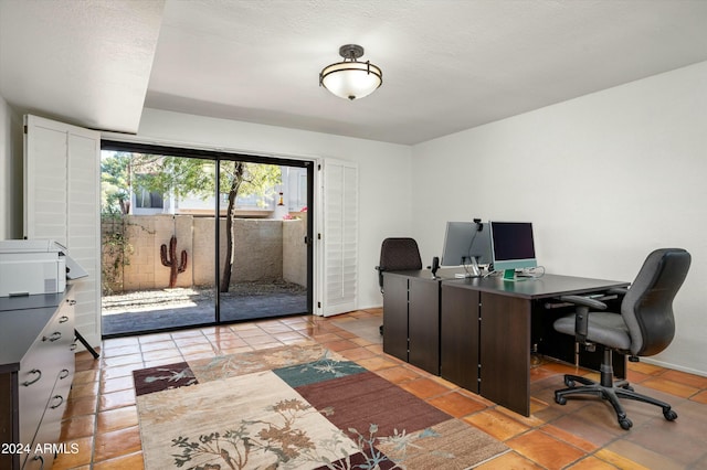 tiled office with a textured ceiling