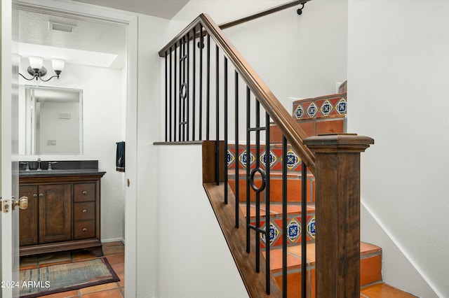 stairway featuring tile patterned flooring