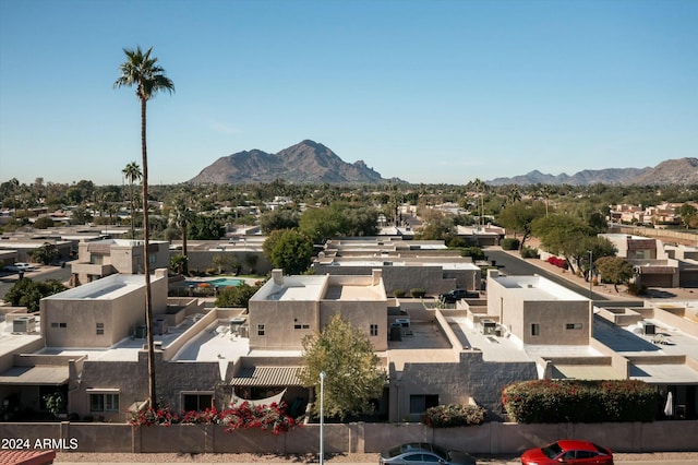 birds eye view of property with a mountain view