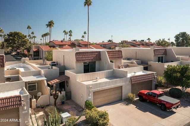 southwest-style home featuring a garage