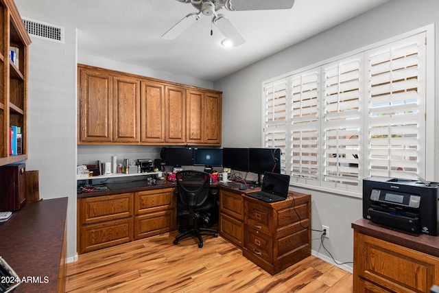 home office featuring ceiling fan and light hardwood / wood-style floors