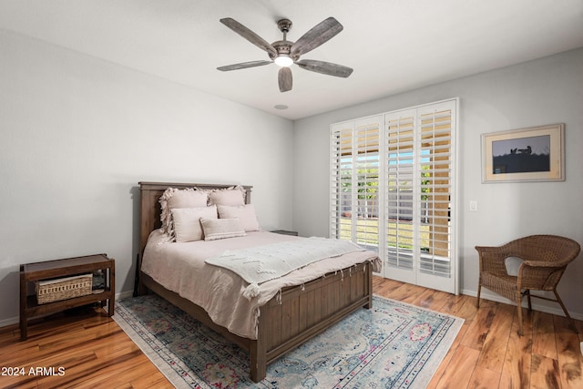 bedroom featuring access to outside, ceiling fan, and hardwood / wood-style flooring