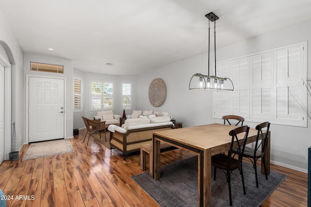 dining space with hardwood / wood-style flooring