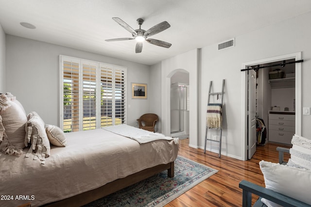 bedroom with wood-type flooring and ceiling fan