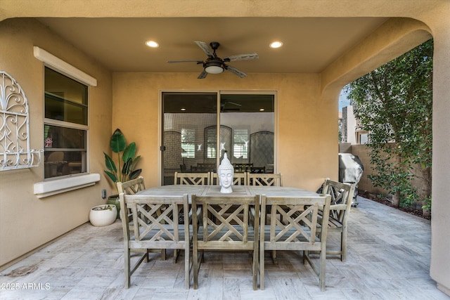 view of patio featuring ceiling fan, outdoor dining space, and area for grilling