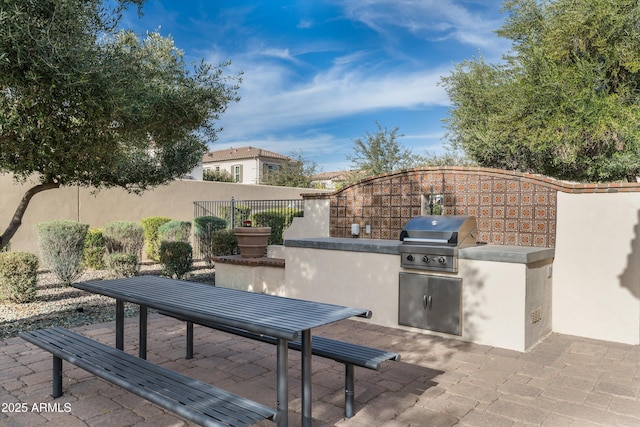 view of patio / terrace featuring fence, grilling area, and area for grilling