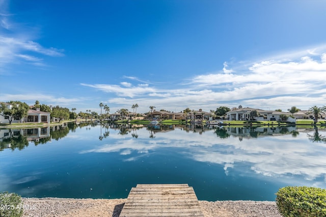 water view featuring a boat dock and a residential view