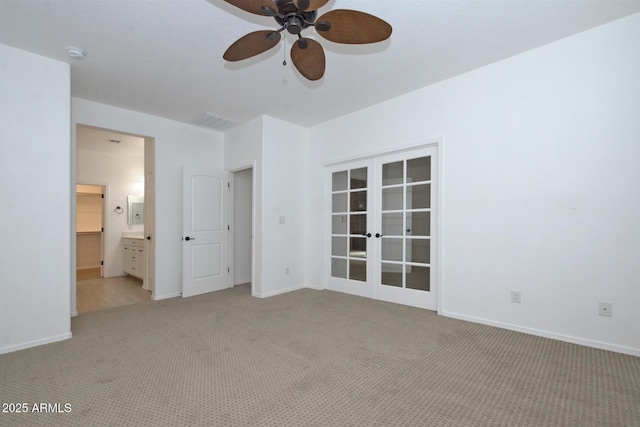 unfurnished bedroom with french doors, light carpet, visible vents, and baseboards