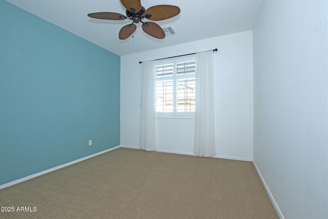 empty room with a ceiling fan, baseboards, visible vents, and carpet flooring