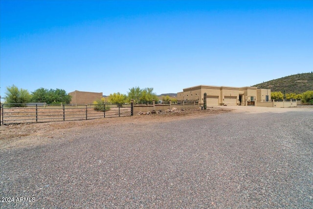 exterior space with a rural view and fence