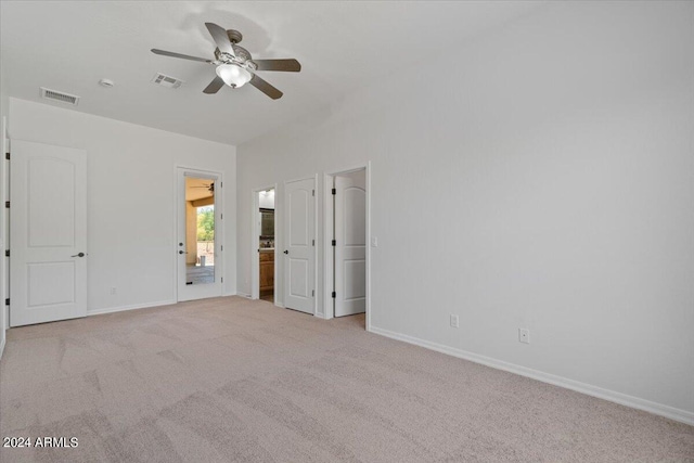 unfurnished bedroom with ceiling fan and carpet flooring