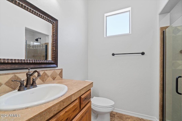 bathroom featuring an enclosed shower, backsplash, toilet, and vanity