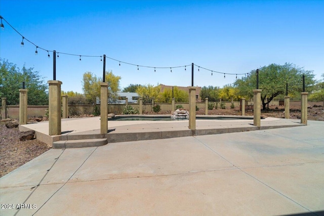 view of terrace featuring an empty pool