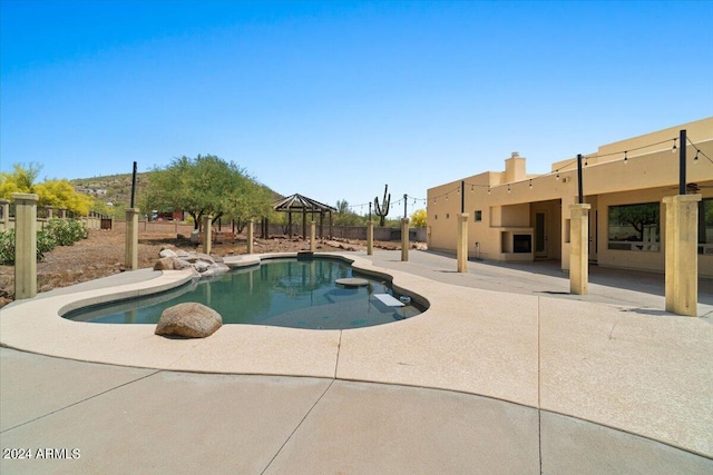 view of pool with a gazebo and a patio area